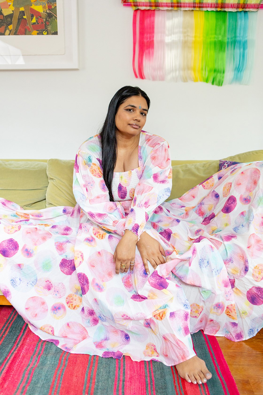 woman in colorful room wearing Eva Dress from abacaxi