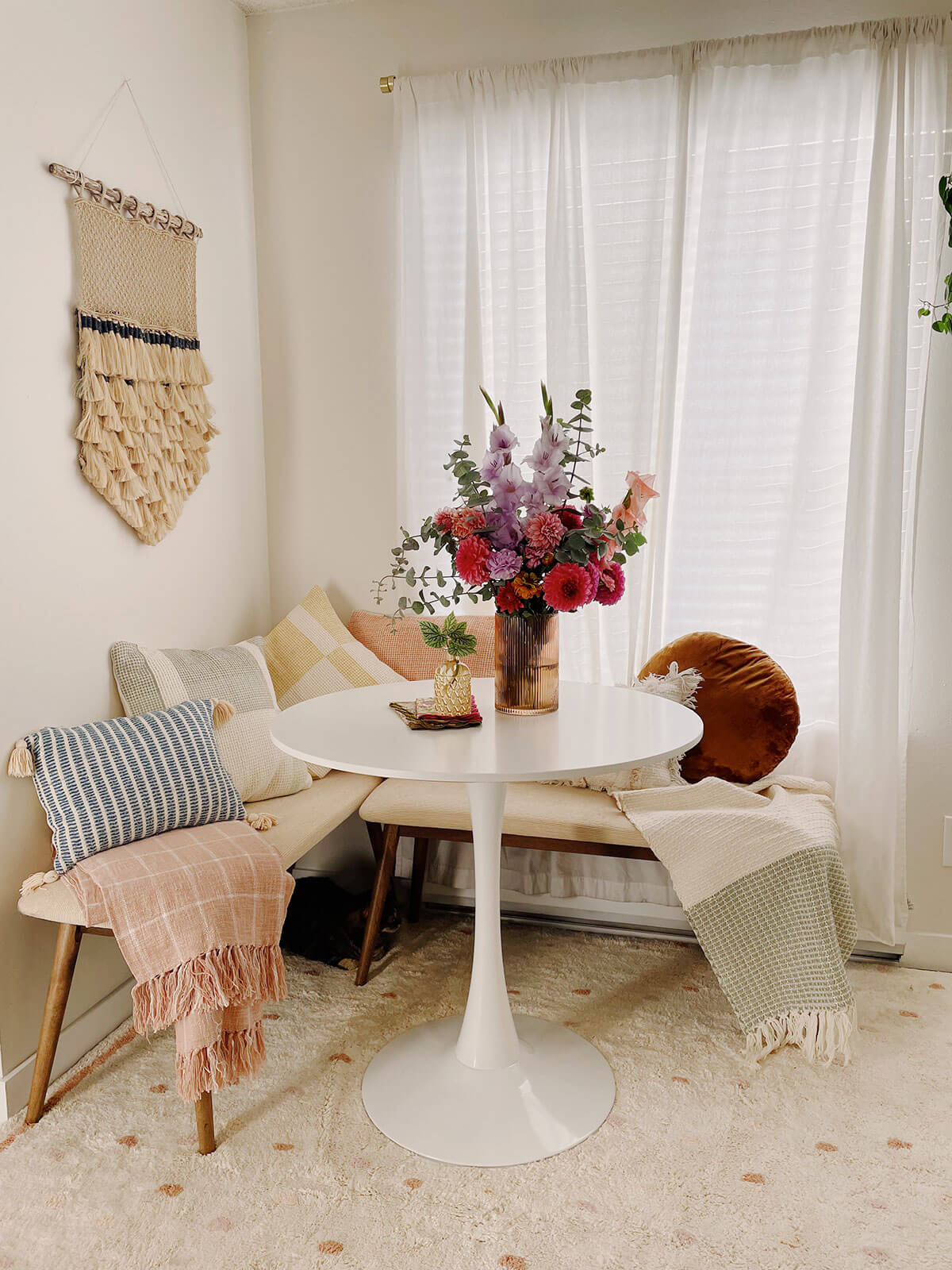 dining nook with benches and round table